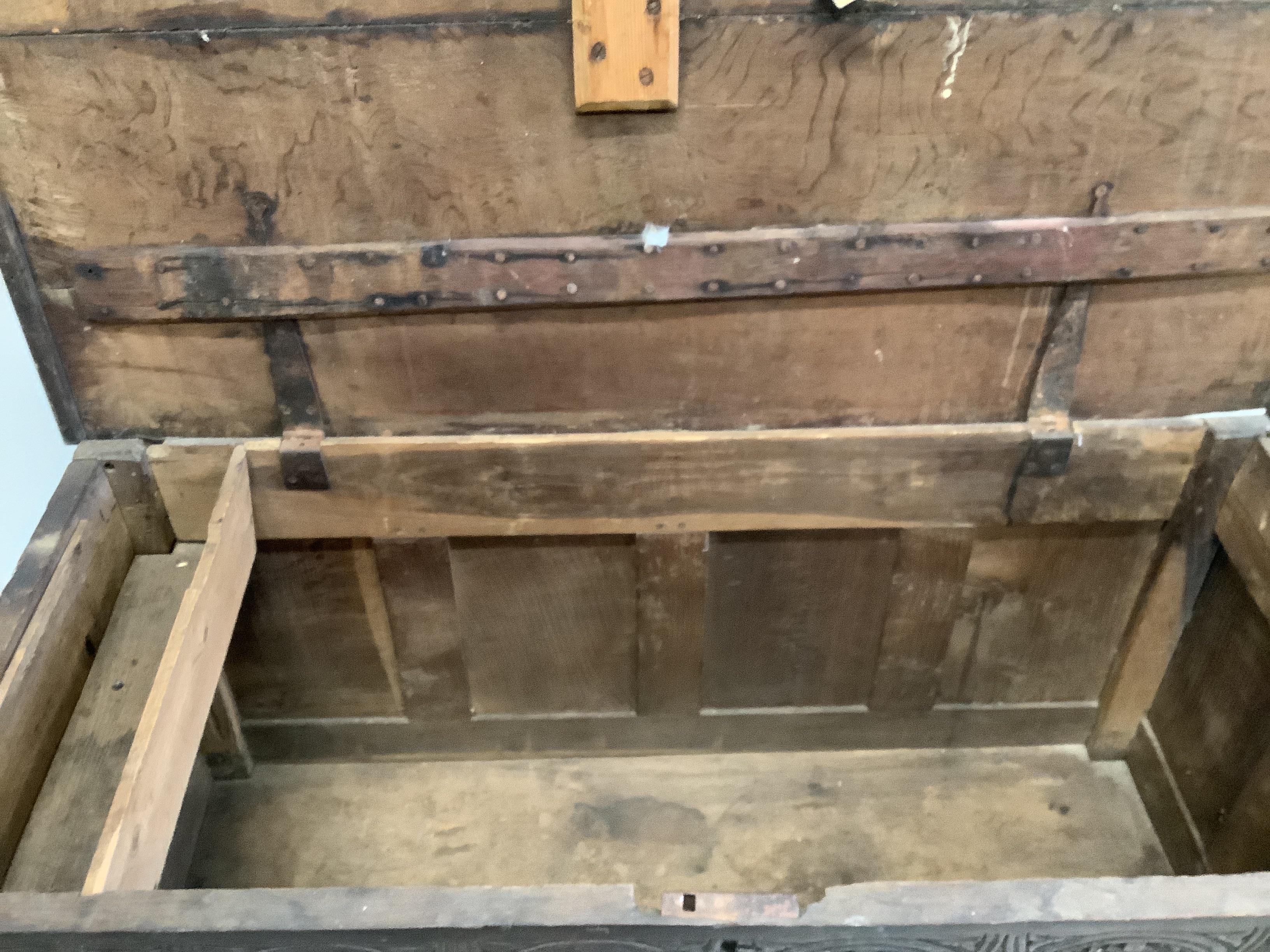 A 17th / 18th century West Country panelled oak coffer, width 122cm, depth 55cm, height 71cm